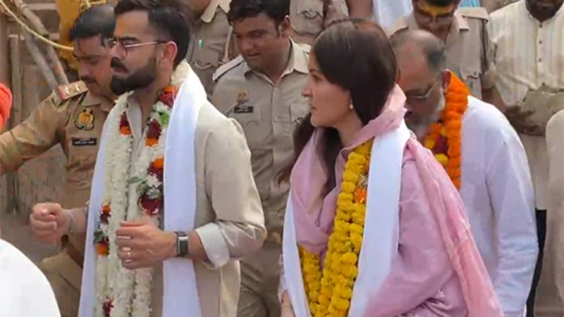 Virat Kohli and Anushka Sharma wearing ethnic attire visiting Ram Temple in Ayodhya.